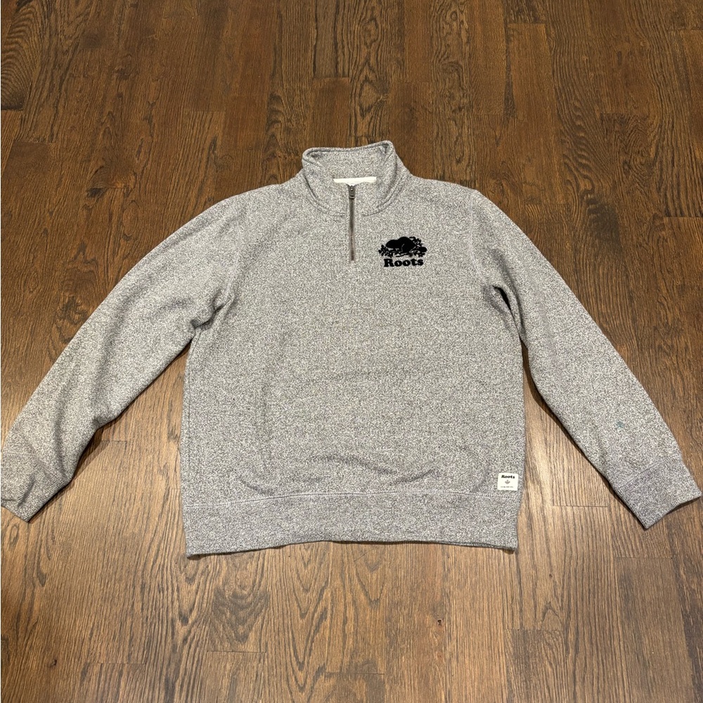 Roots sweatshirt. Black/grey. Small blue spot on left sleeve